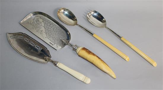 A George III silver fish slice with ivory handle, a later silver crumb scoop and pair of servers, all with ivory handles.